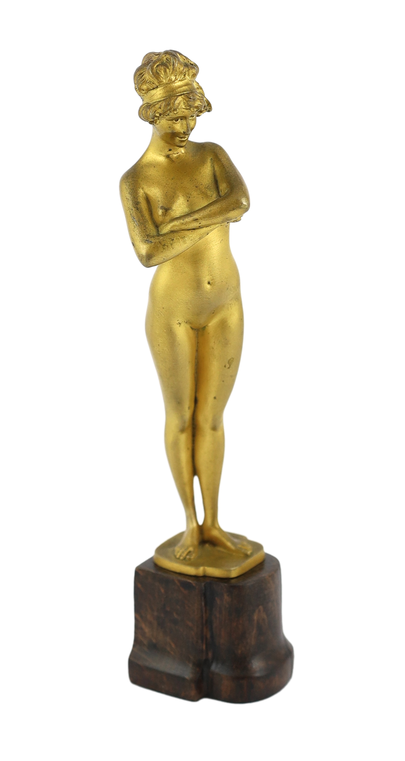 Paul Philippe (French, 1870-1930), a gilt bronze figure of a standing nude woman, 'The Challenge', 21.5cm high